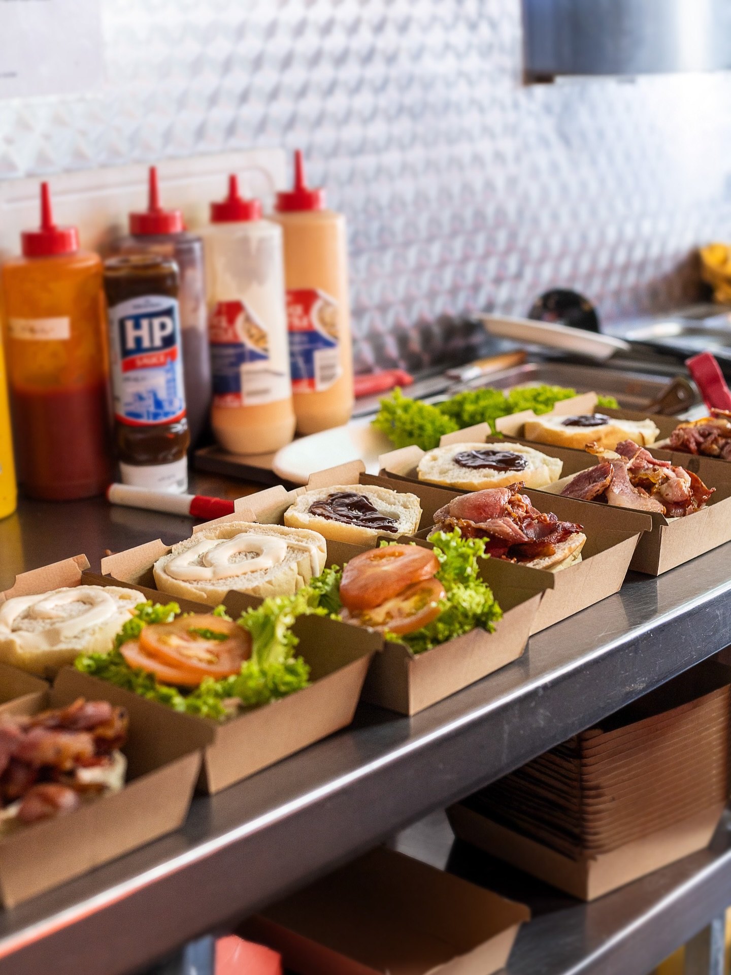 Burgers being built at The Butcher's Apron